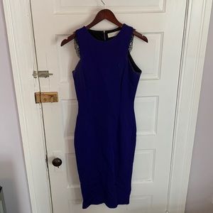 Victoria Beckham purple dress with black lace sleeve detail